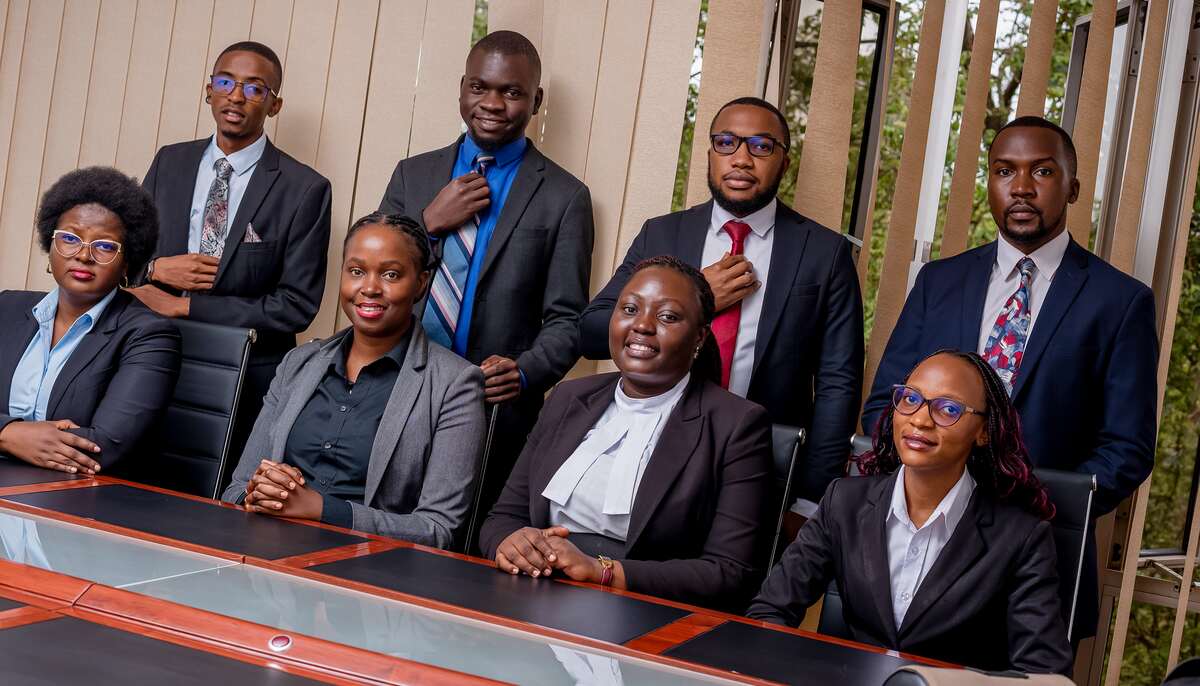 Kaaya Birikujja Advocates team gathered in the firm's office